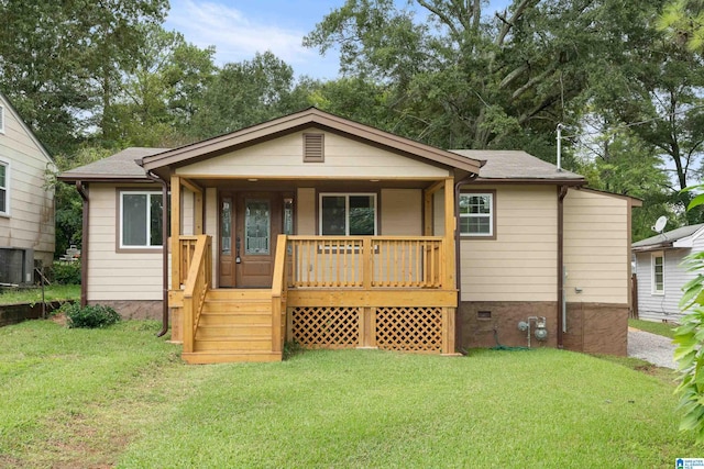 view of front of property featuring a porch, central air condition unit, and a front lawn