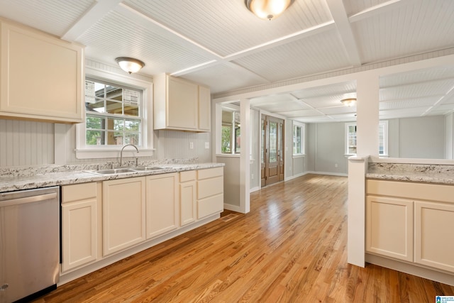 kitchen featuring light stone countertops, sink, dishwasher, light hardwood / wood-style flooring, and cream cabinetry