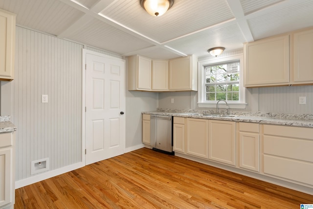 kitchen with sink, dishwasher, light hardwood / wood-style floors, and cream cabinetry