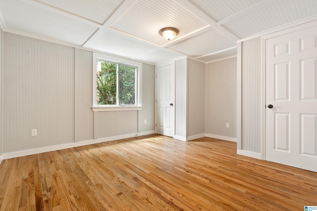 unfurnished bedroom featuring light hardwood / wood-style floors and coffered ceiling