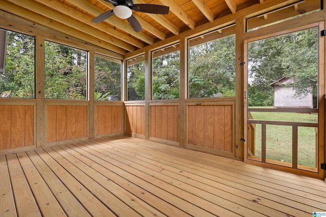 unfurnished sunroom with ceiling fan, lofted ceiling, and wooden ceiling