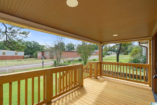 wooden terrace with a yard