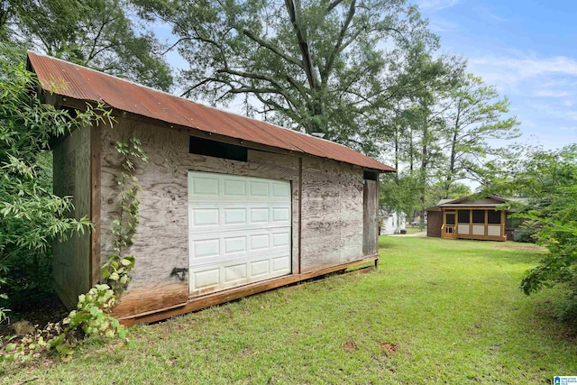 garage featuring a yard