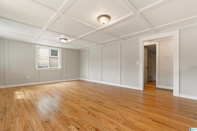 unfurnished room featuring light hardwood / wood-style floors and coffered ceiling