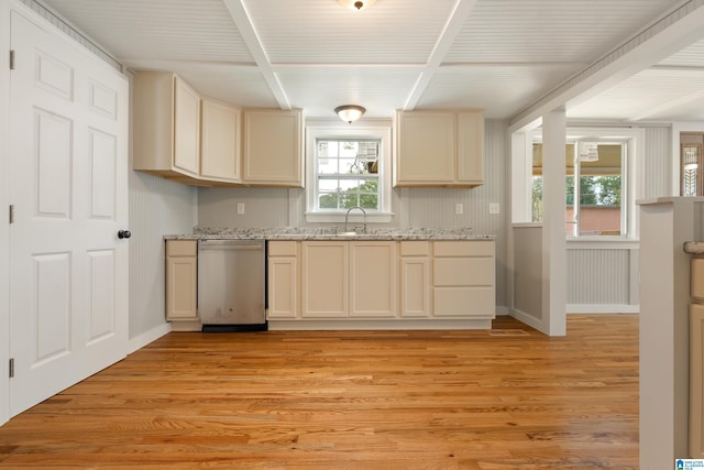 kitchen with light stone countertops, sink, cream cabinetry, light hardwood / wood-style flooring, and dishwasher