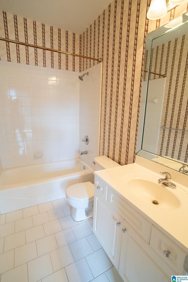 full bathroom with tile patterned floors, vanity, toilet, and tiled shower / bath