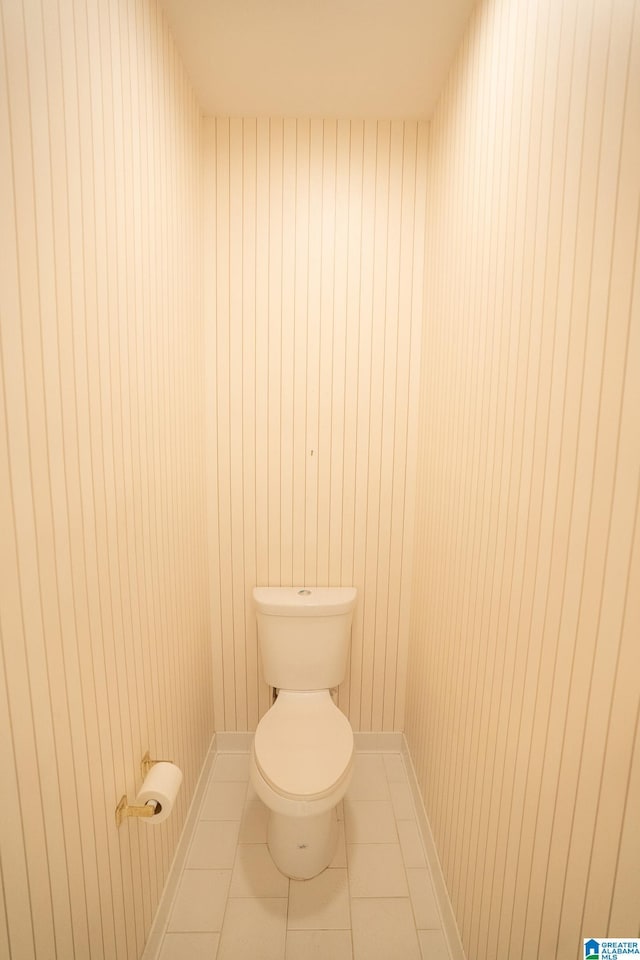 bathroom with tile patterned flooring and toilet