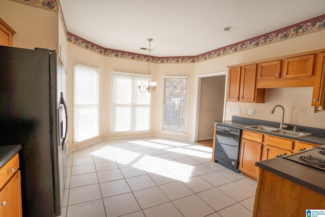 kitchen with stainless steel fridge, black dishwasher, light tile patterned floors, and sink