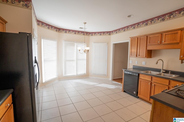 kitchen with sink, an inviting chandelier, dishwasher, stainless steel refrigerator, and light tile patterned flooring