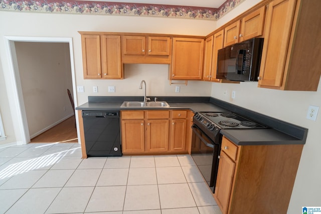 kitchen with sink, light tile patterned floors, and black appliances