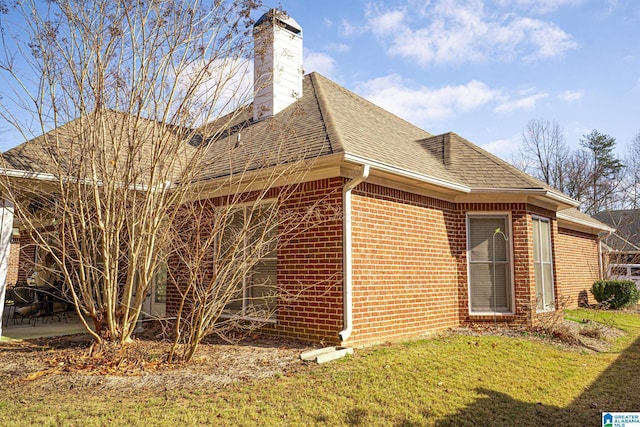 view of property exterior with a yard