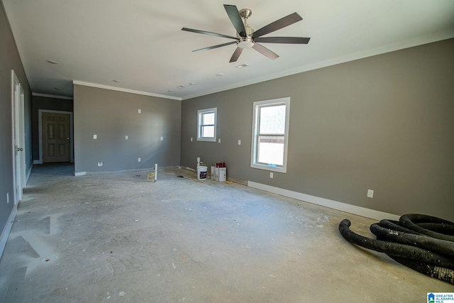 unfurnished room with ceiling fan and crown molding