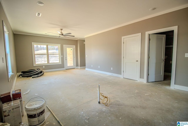 interior space with ceiling fan and ornamental molding