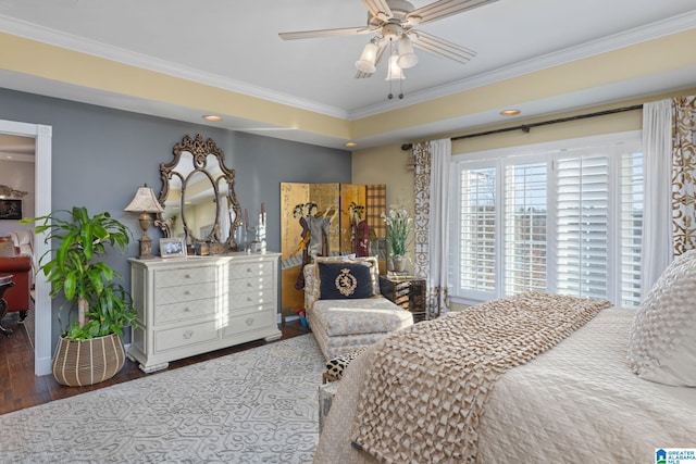 bedroom featuring ceiling fan, dark hardwood / wood-style floors, and crown molding