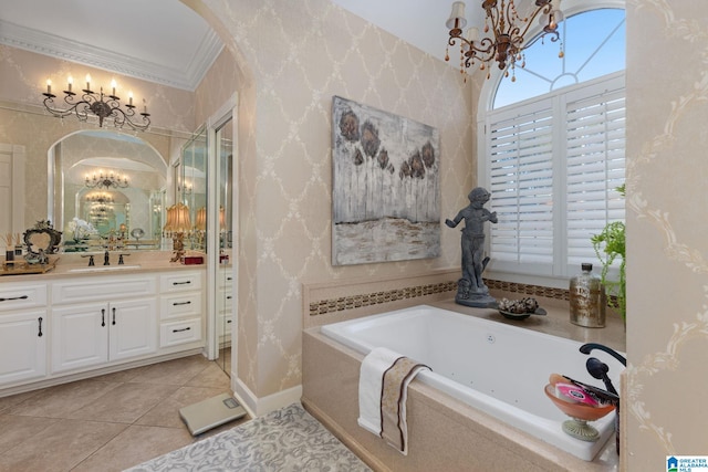 bathroom with tile patterned floors, tiled tub, vanity, and ornamental molding