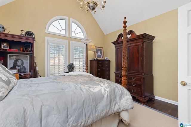 bedroom featuring high vaulted ceiling, dark hardwood / wood-style floors, and an inviting chandelier