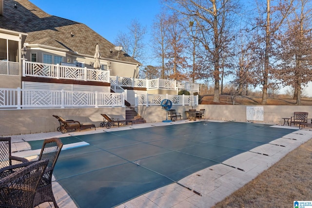 view of swimming pool featuring a patio