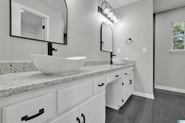 bathroom featuring tile patterned flooring and vanity