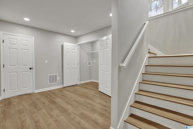 stairway with wood-type flooring