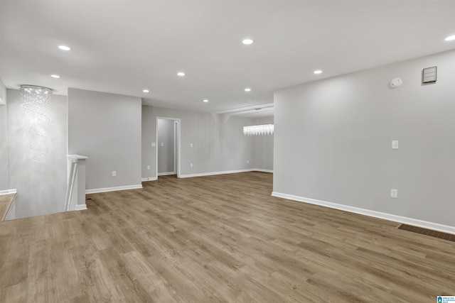 unfurnished living room featuring light hardwood / wood-style flooring