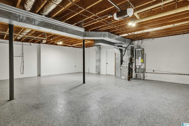 basement featuring heating unit and water heater