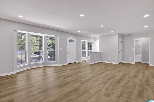 unfurnished living room featuring light hardwood / wood-style flooring