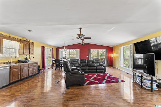 living room with ceiling fan, sink, dark hardwood / wood-style floors, and lofted ceiling