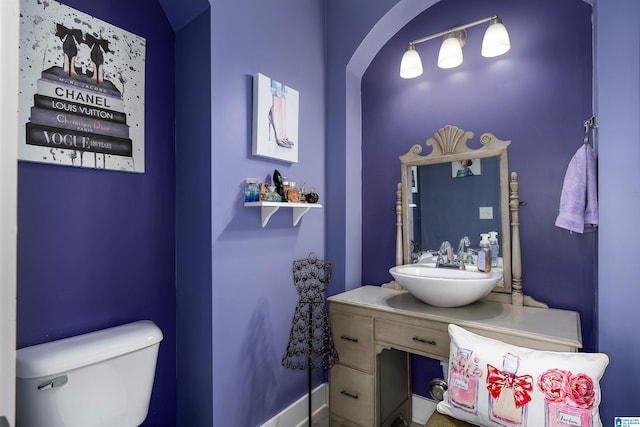 bathroom with vanity and toilet