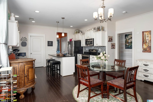 dining room with ornamental molding, dark hardwood / wood-style flooring, and a notable chandelier