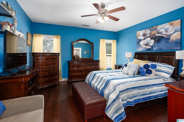 bedroom featuring ceiling fan and dark hardwood / wood-style flooring