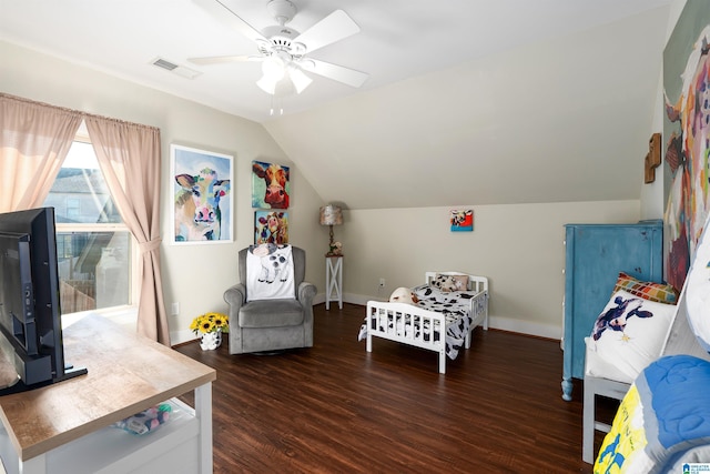 bedroom featuring dark hardwood / wood-style flooring, vaulted ceiling, and ceiling fan