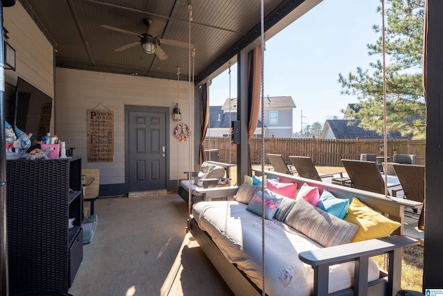 view of patio with an outdoor living space and ceiling fan