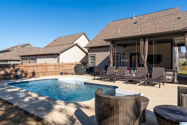 view of pool featuring grilling area and a patio