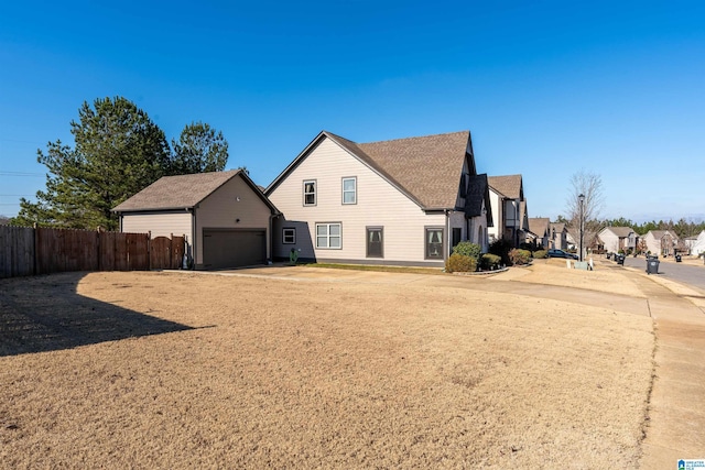 view of side of property featuring a garage