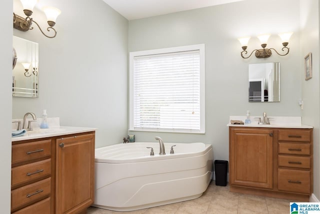 bathroom with vanity, tile patterned floors, and a tub to relax in