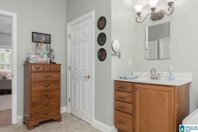 bathroom with tile patterned floors and vanity