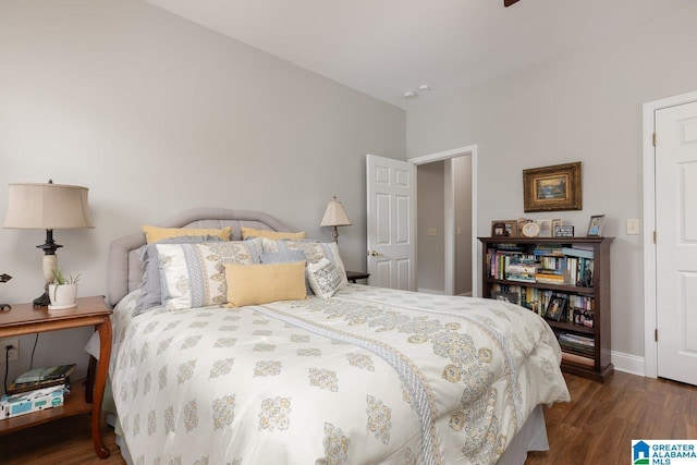 bedroom featuring dark wood-type flooring