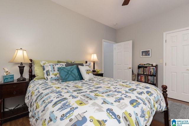 bedroom with ceiling fan and dark wood-type flooring