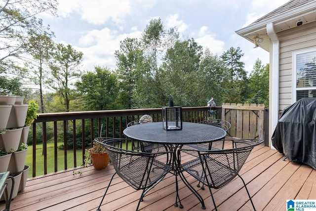 wooden terrace with a yard