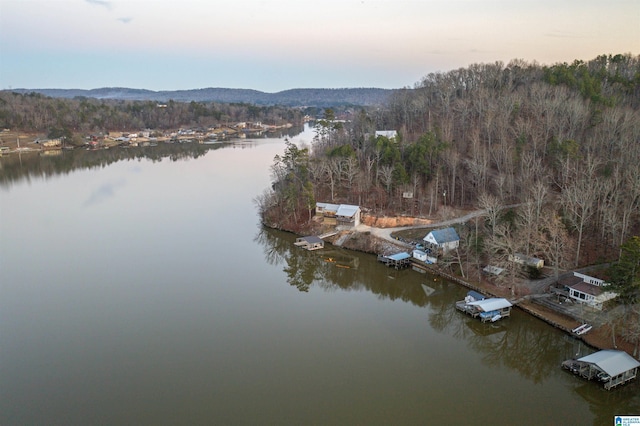 aerial view at dusk with a water view