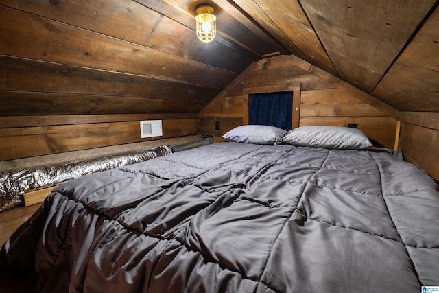 unfurnished bedroom featuring wood walls, vaulted ceiling, and wood ceiling