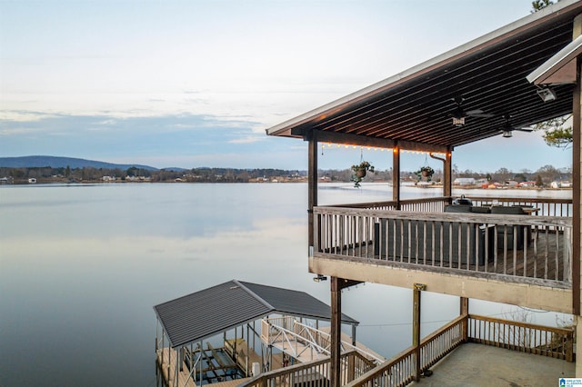 dock area featuring a water and mountain view