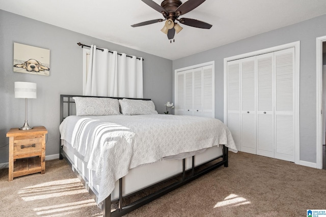 bedroom with multiple closets, ceiling fan, and carpet flooring