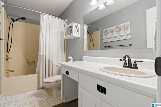 full bathroom with tile patterned flooring, shower / bath combo, vanity, and toilet