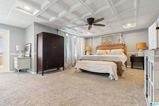 carpeted bedroom featuring coffered ceiling and ceiling fan