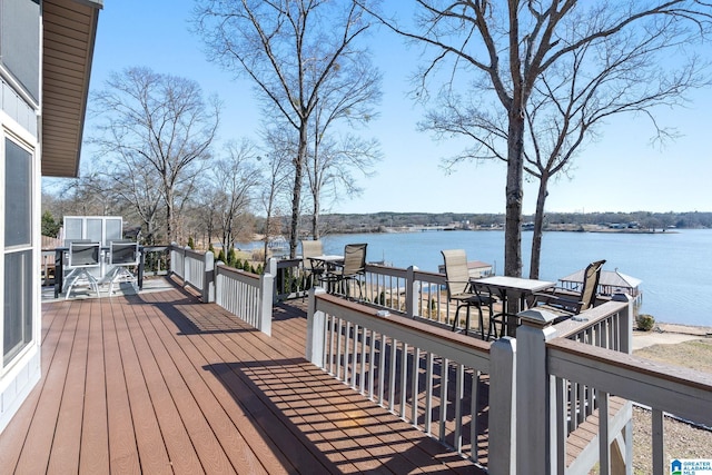 wooden terrace featuring a water view