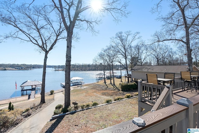 dock area featuring a gazebo and a water view