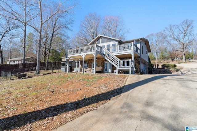 exterior space with a garage and a deck