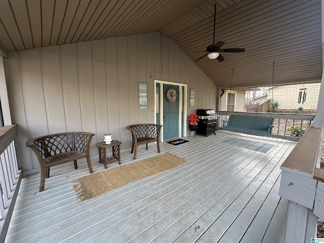 wooden deck featuring ceiling fan and grilling area