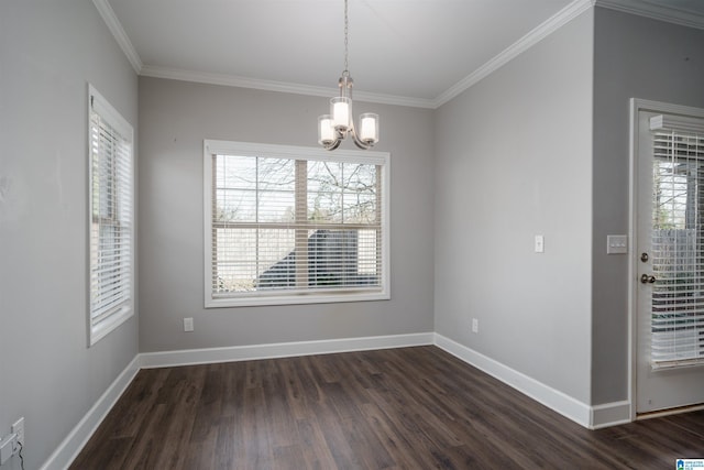 unfurnished dining area with dark hardwood / wood-style floors, an inviting chandelier, and ornamental molding